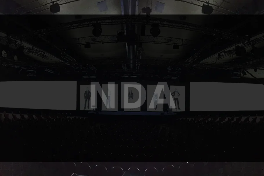 Corporate event stage with large video displays