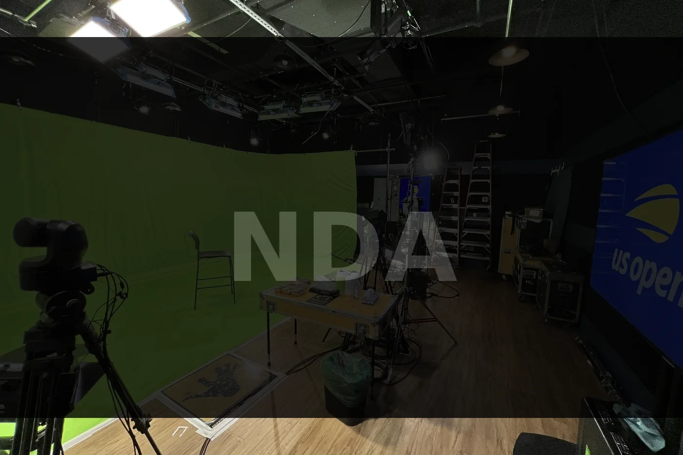 Studio with chromakey green screen and lighting