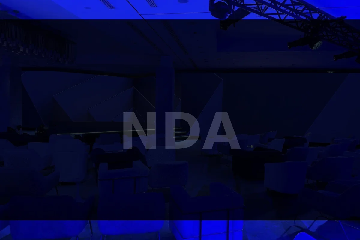 Blue-lit auditorium production environment